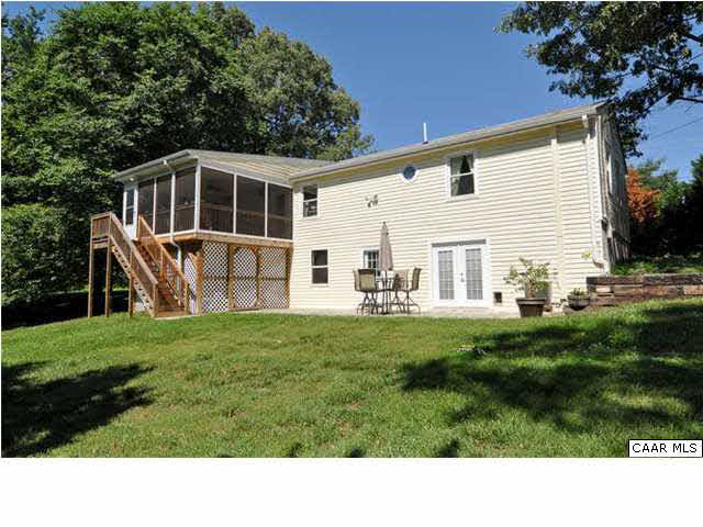 126 North Boston Road Troy, VA 22974 - Photo 29 of 39 Rear view of home, showing screened porch, double door entrance to basement and masonry patio.