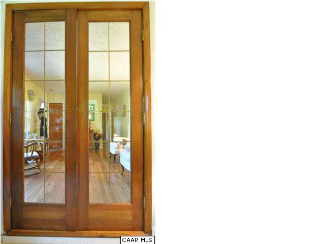 Access from the family room to the living room is through these custom french doors.