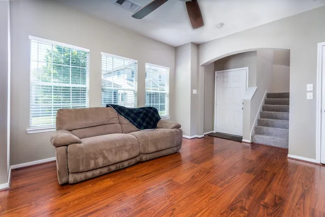 a living room with furniture and a large window