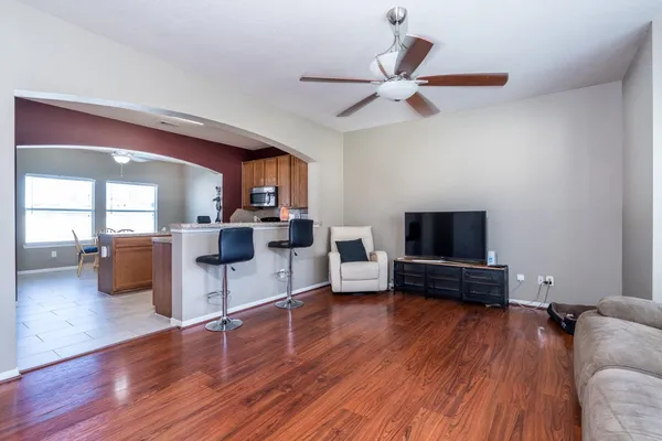 a living room with furniture and a flat screen tv
