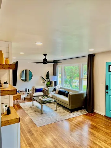 a living room with furniture and a large window