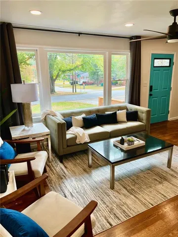 a living room with furniture and a window