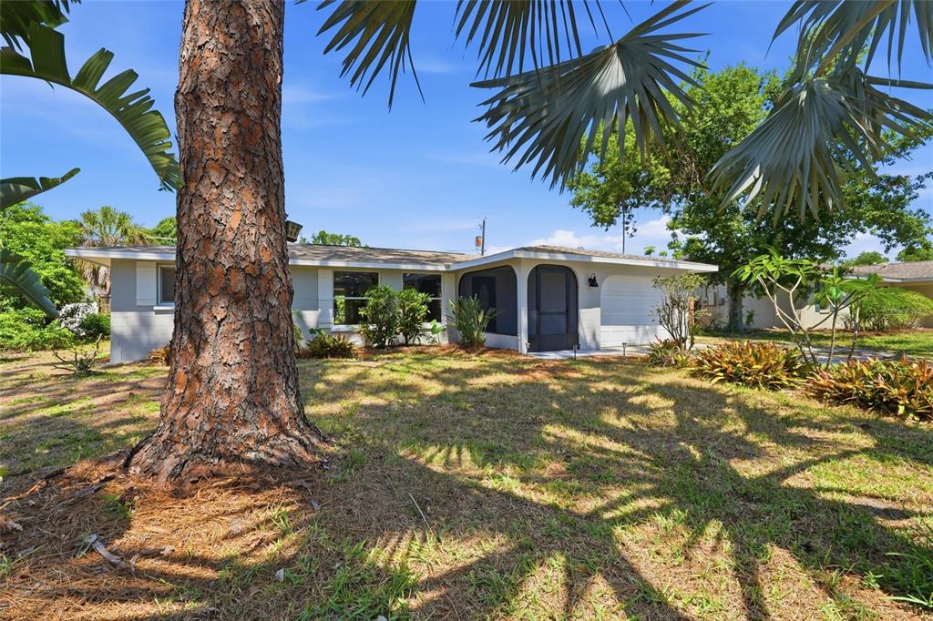 5984 Diana Road Venice, FL 34293 - Photo 2 of 36 a front view of house with yard