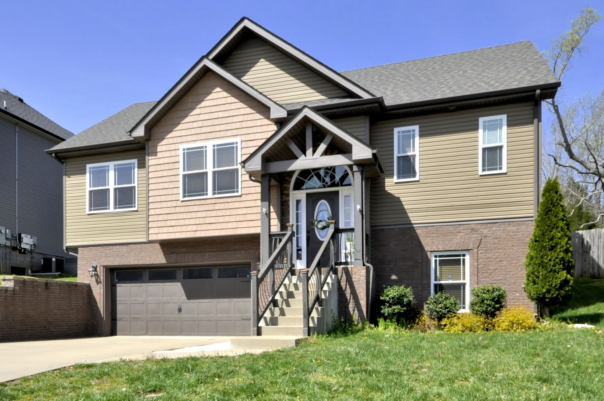 a front view of a house with a yard