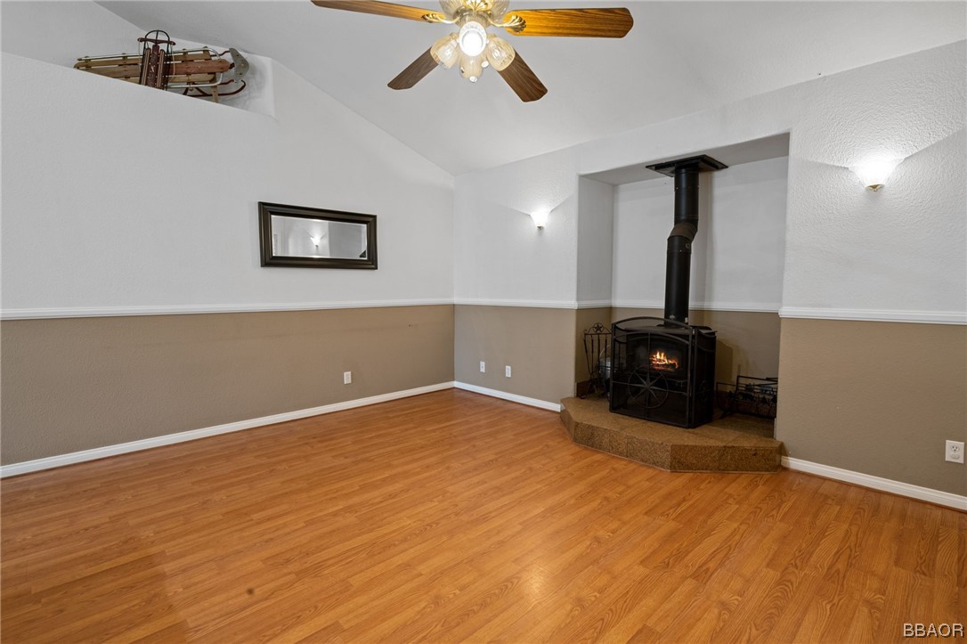 307 Riverside Avenue Sugarloaf, CA 92386 - Photo 6 of 31 a view of empty room with wooden floor