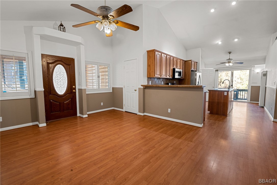 307 Riverside Avenue Sugarloaf, CA 92386 - Photo 8 of 31 a view of kitchen and window with wooden floor