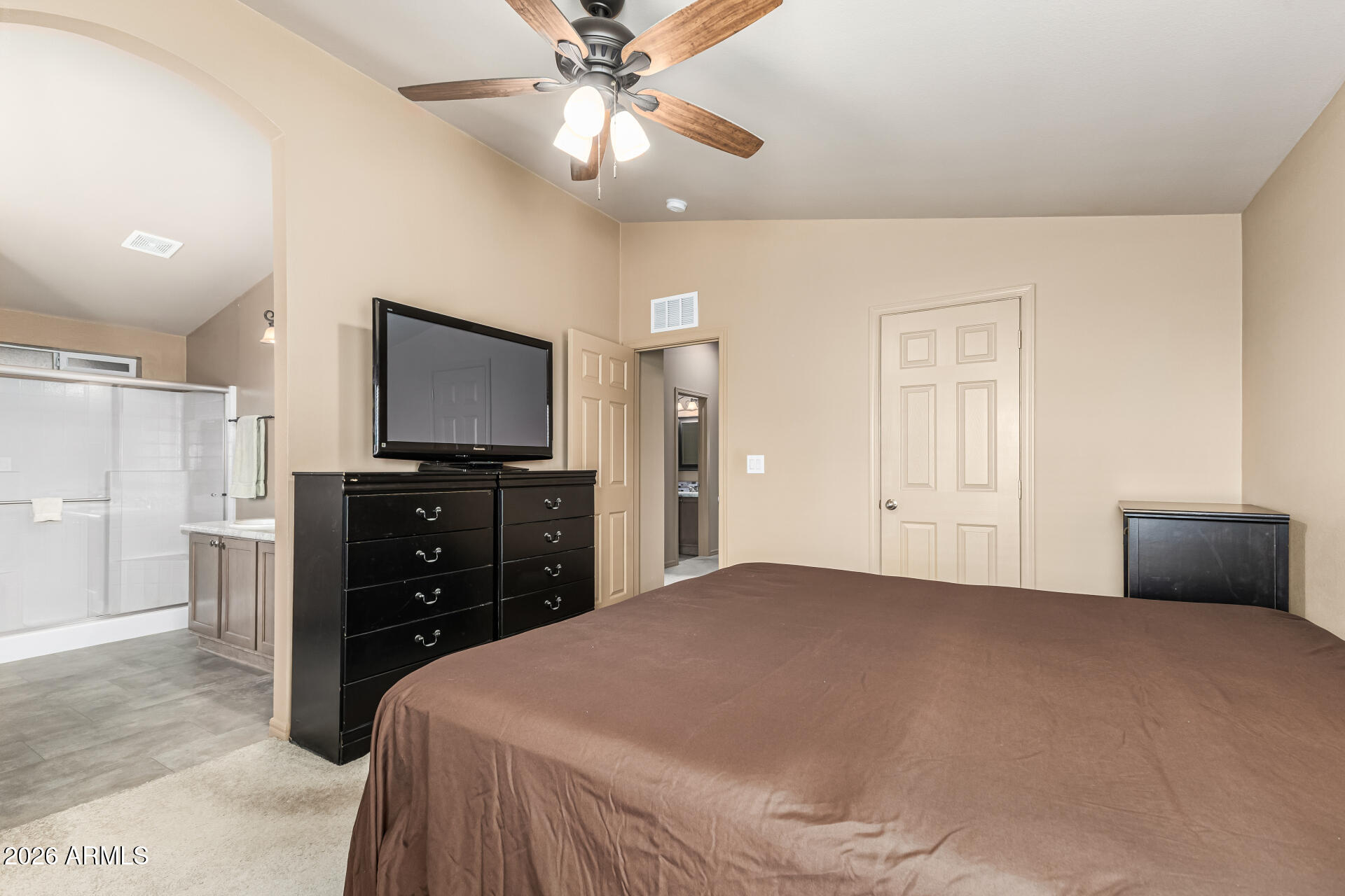 9302 East Broadway Road, Unit 117 Mesa, AZ 85208 - Photo 14 of 24 a bedroom with a bed and a ceiling fan