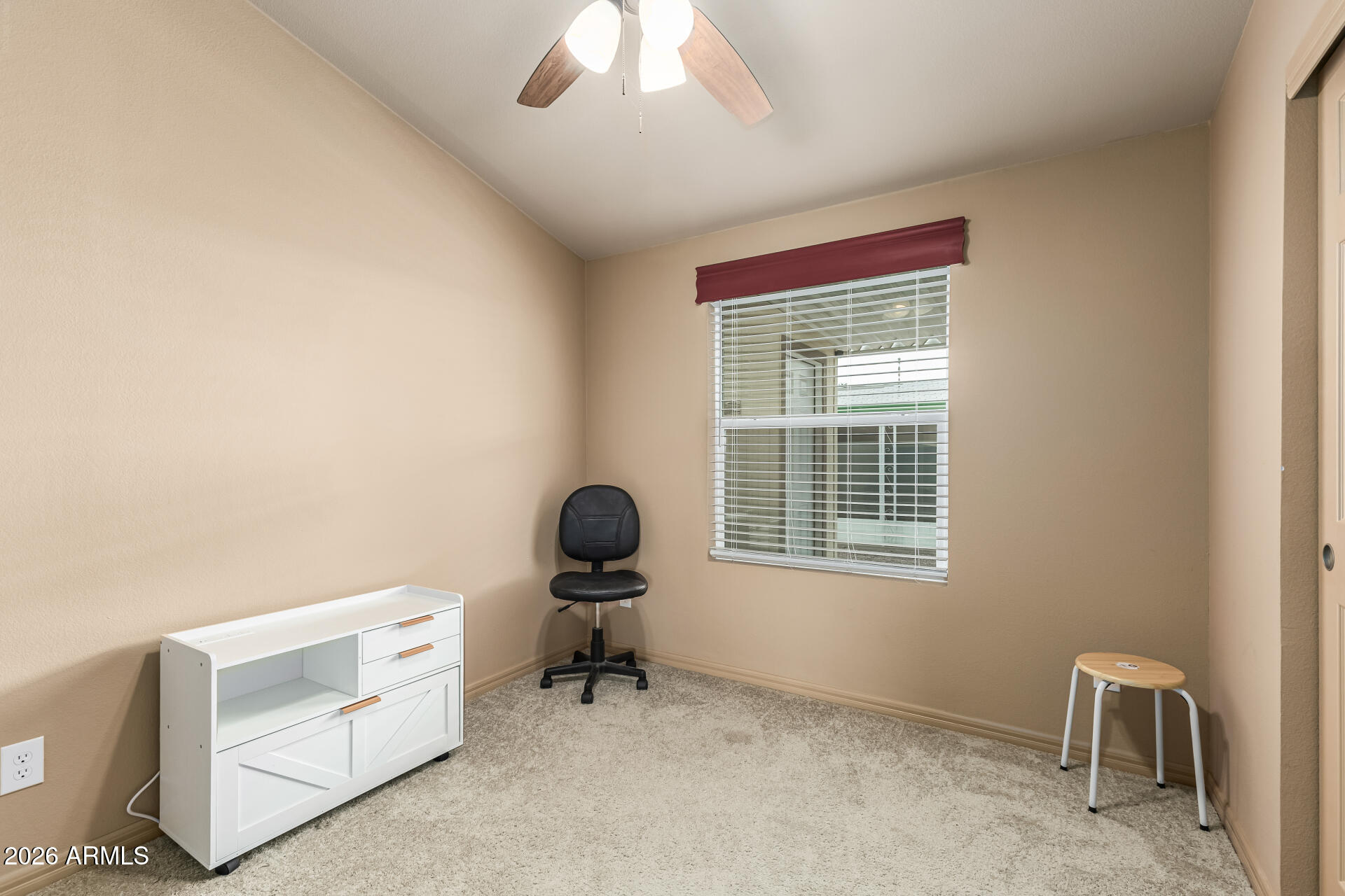 9302 East Broadway Road, Unit 117 Mesa, AZ 85208 - Photo 16 of 24 a workspace with furniture and a window