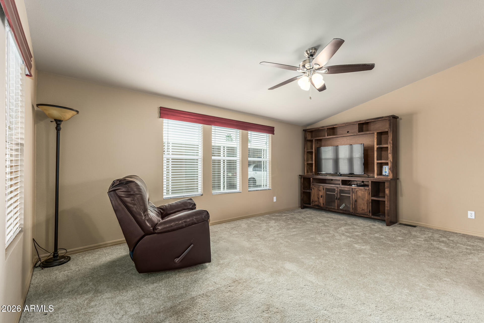 9302 East Broadway Road, Unit 117 Mesa, AZ 85208 - Photo 4 of 24 a living room with furniture and a window
