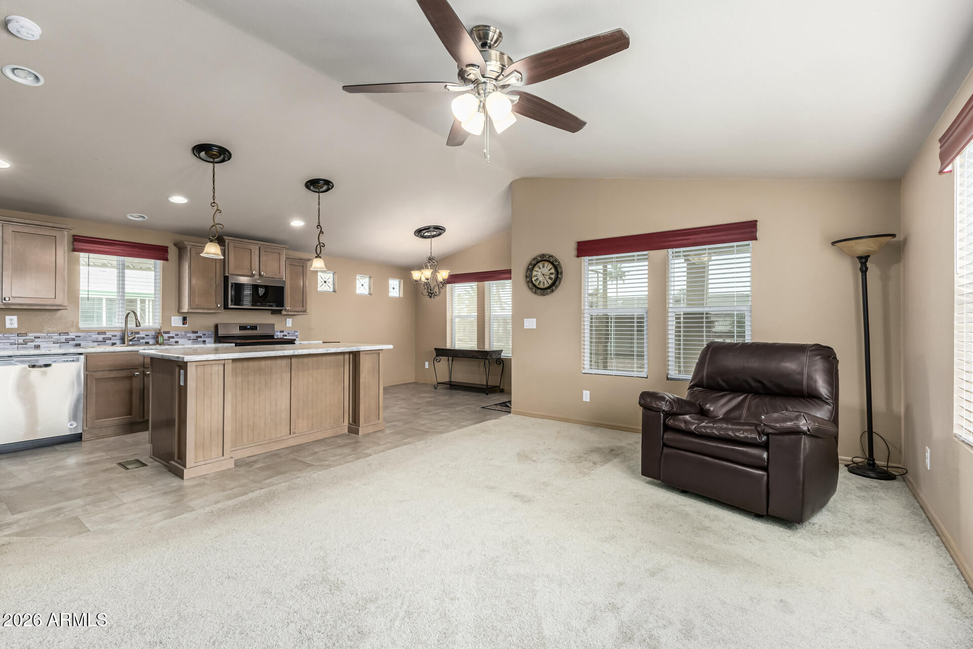 9302 East Broadway Road, Unit 117 Mesa, AZ 85208 - Photo 5 of 24 a living room with furniture and kitchen view
