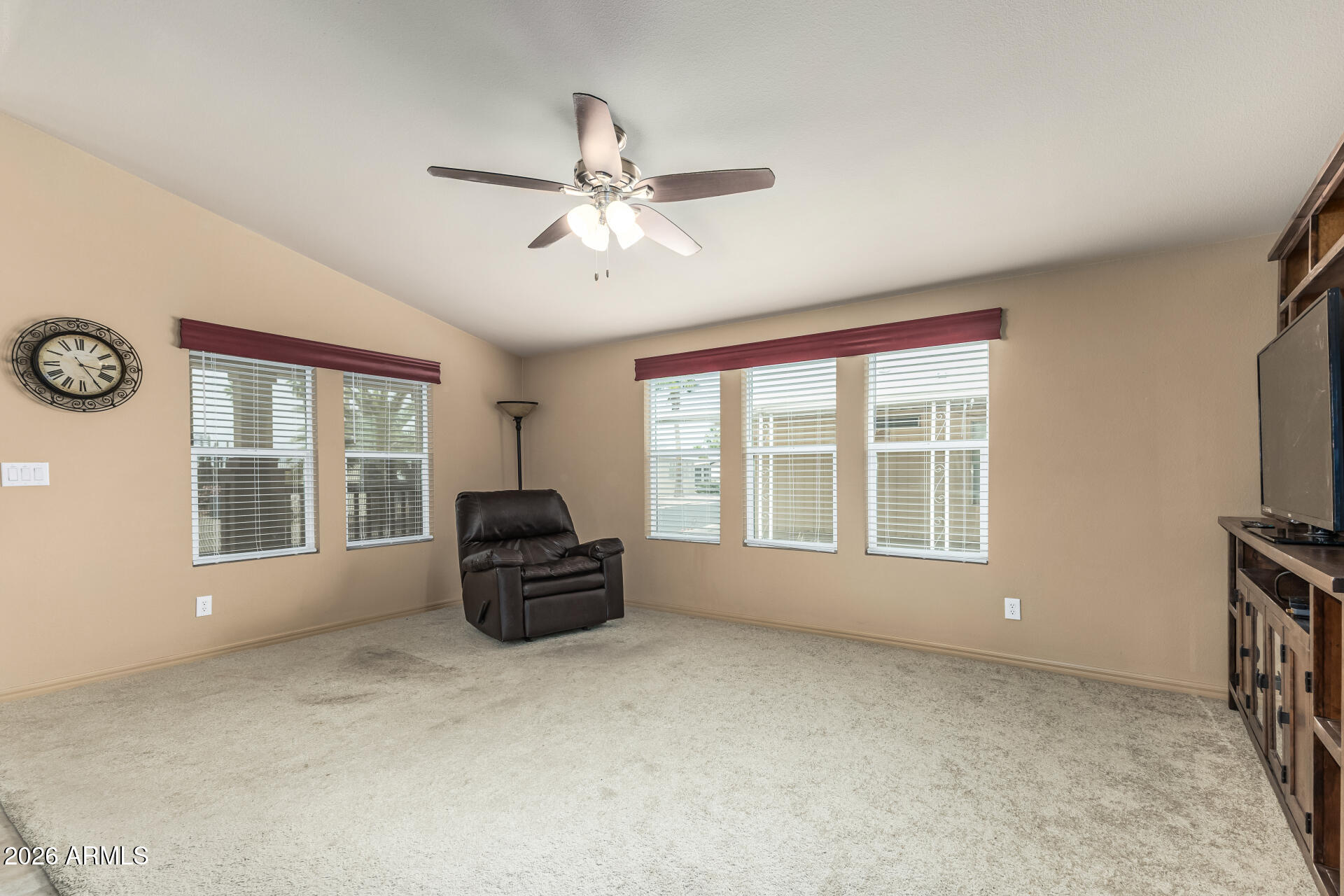 9302 East Broadway Road, Unit 117 Mesa, AZ 85208 - Photo 6 of 24 a living room with furniture and a large window