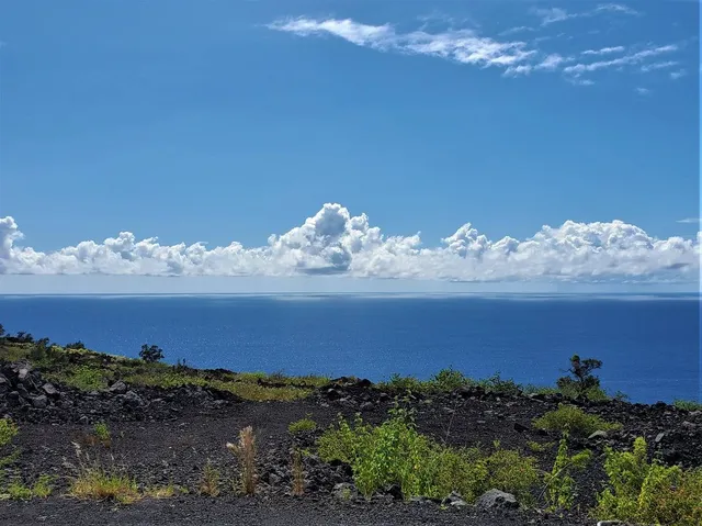 a sunset view with a lake