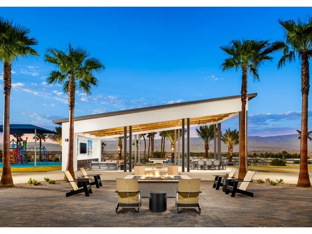 a view of a swimming pool with a lounge chair and couches