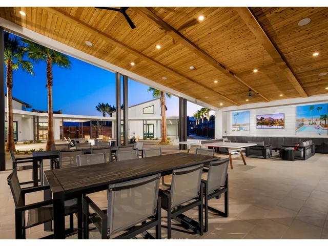 a view of a chairs and tables in a patio