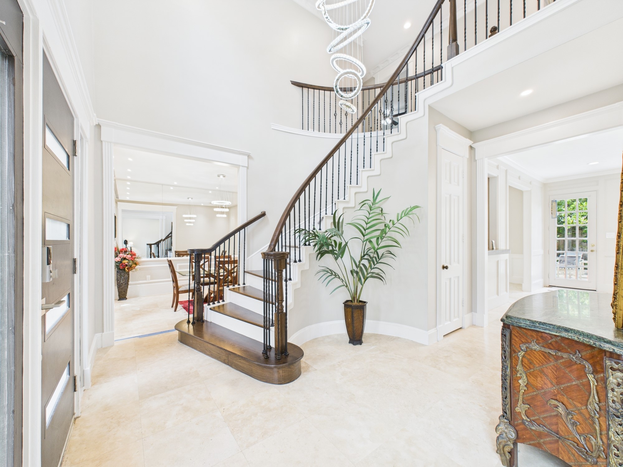 702 Daria Court Houston, TX 77079 - Photo 2 of 44 Inviting Formal Entry with Curved Staircase and High Ceilings