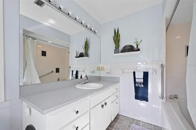 a bathroom with a sink and a mirror