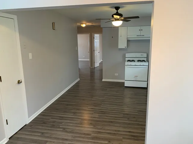 a view of a kitchen from the hallway