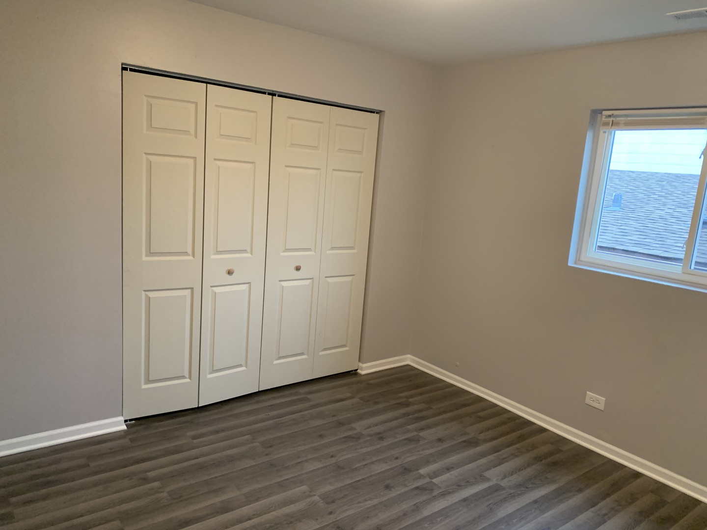 824 South 13th Avenue Maywood, IL 60153 - Photo 9 of 10 a view of an empty room with wooden floor and a window