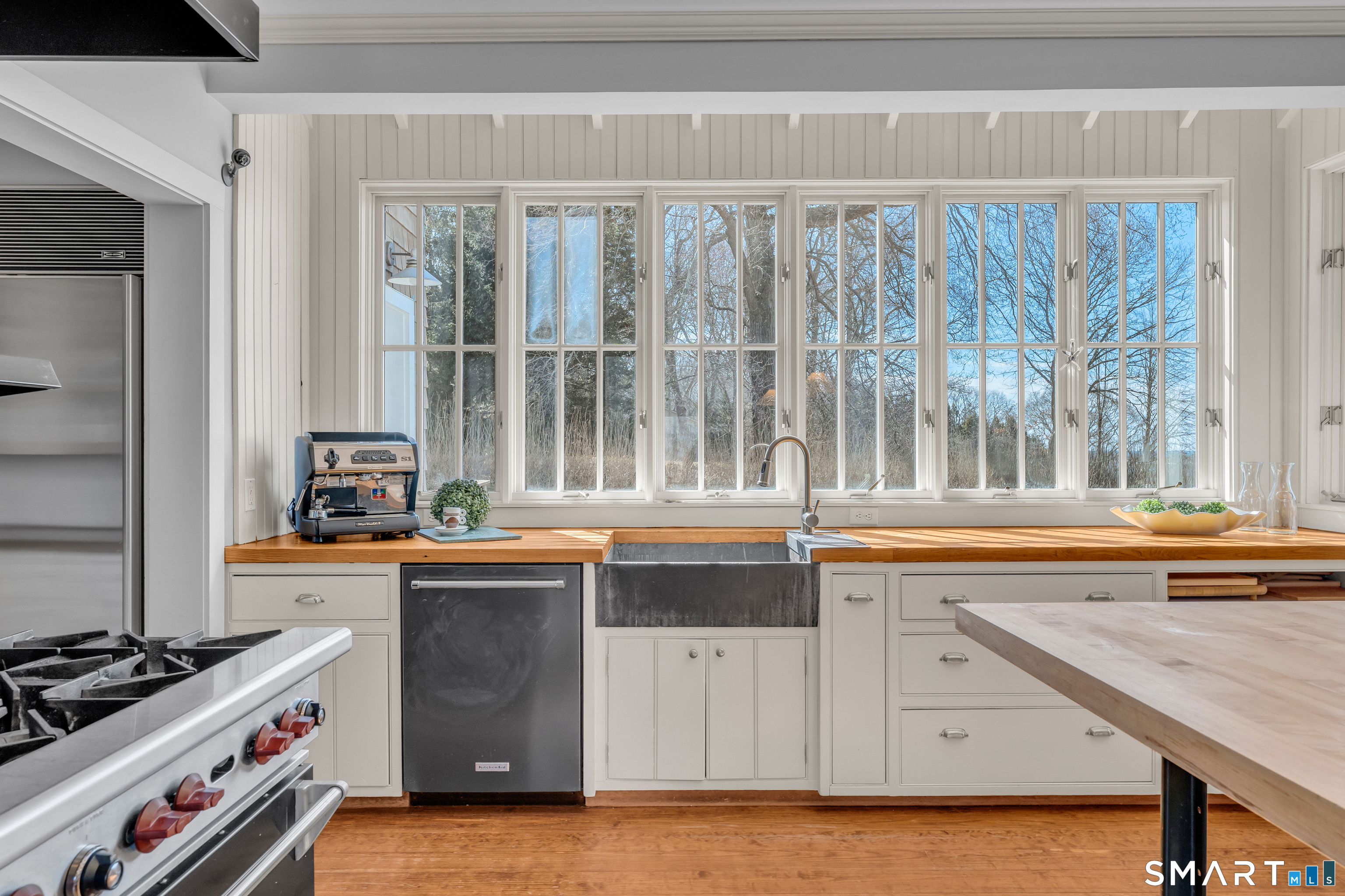 100 Old Black Point Road East Lyme, CT 06357 - Photo 12 of 40 A bank of windows flanks the kitchen sink with water views.