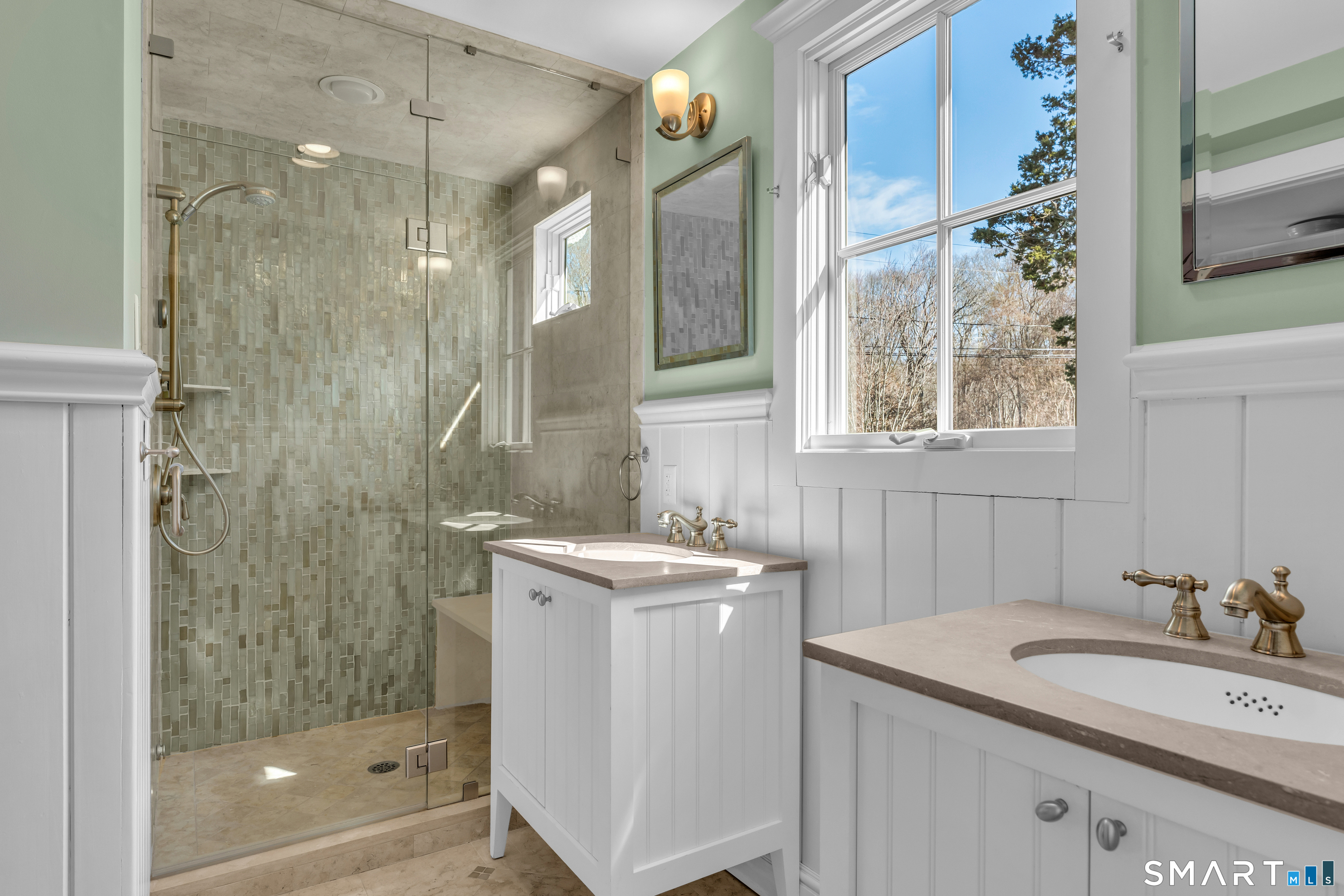 100 Old Black Point Road East Lyme, CT 06357 - Photo 19 of 40 First floor primary bath with custom tiled shower and double vanities.