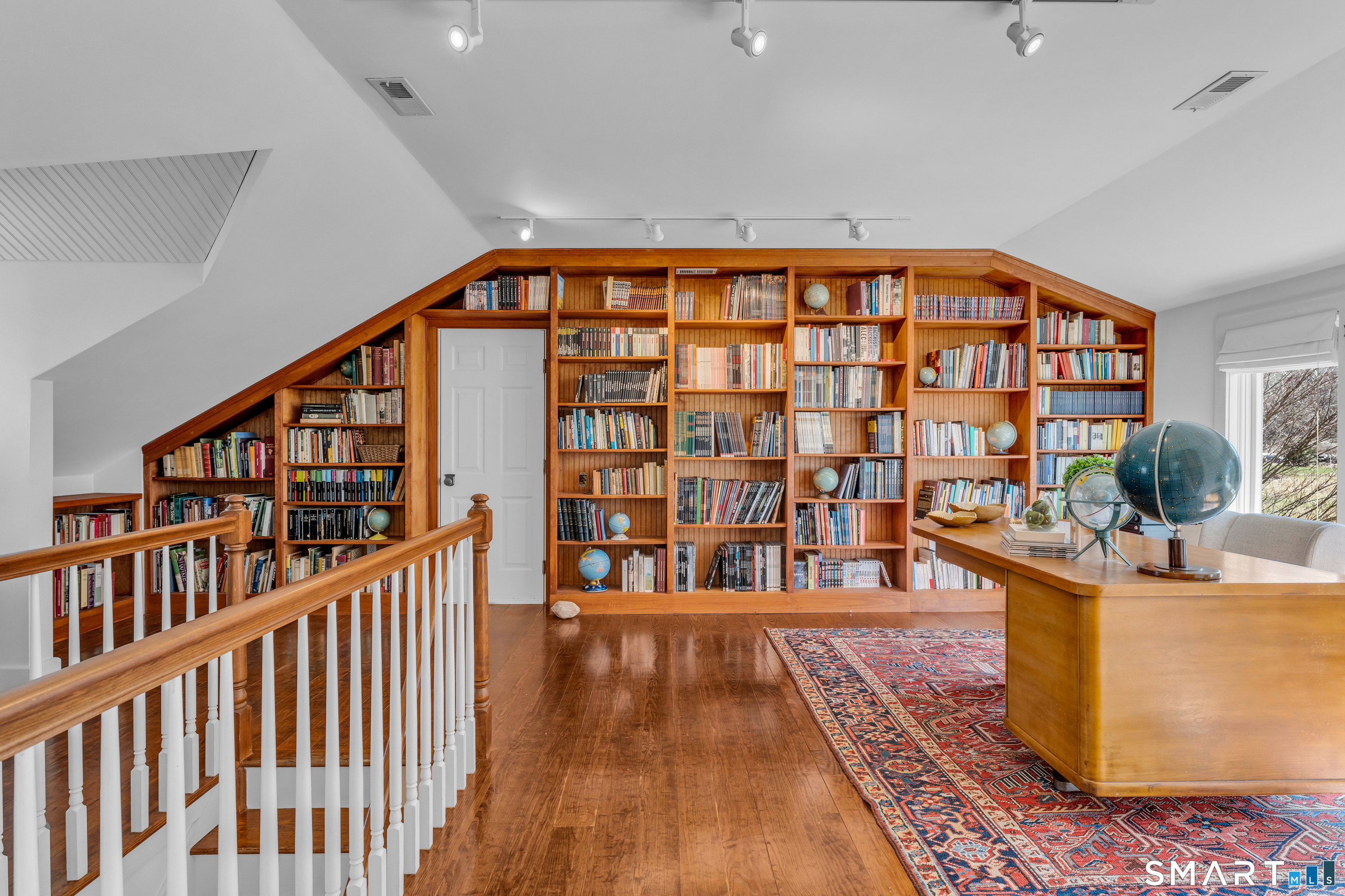 100 Old Black Point Road East Lyme, CT 06357 - Photo 23 of 40 The office has floor to ceiling built-in book cases creating a great work from home space.