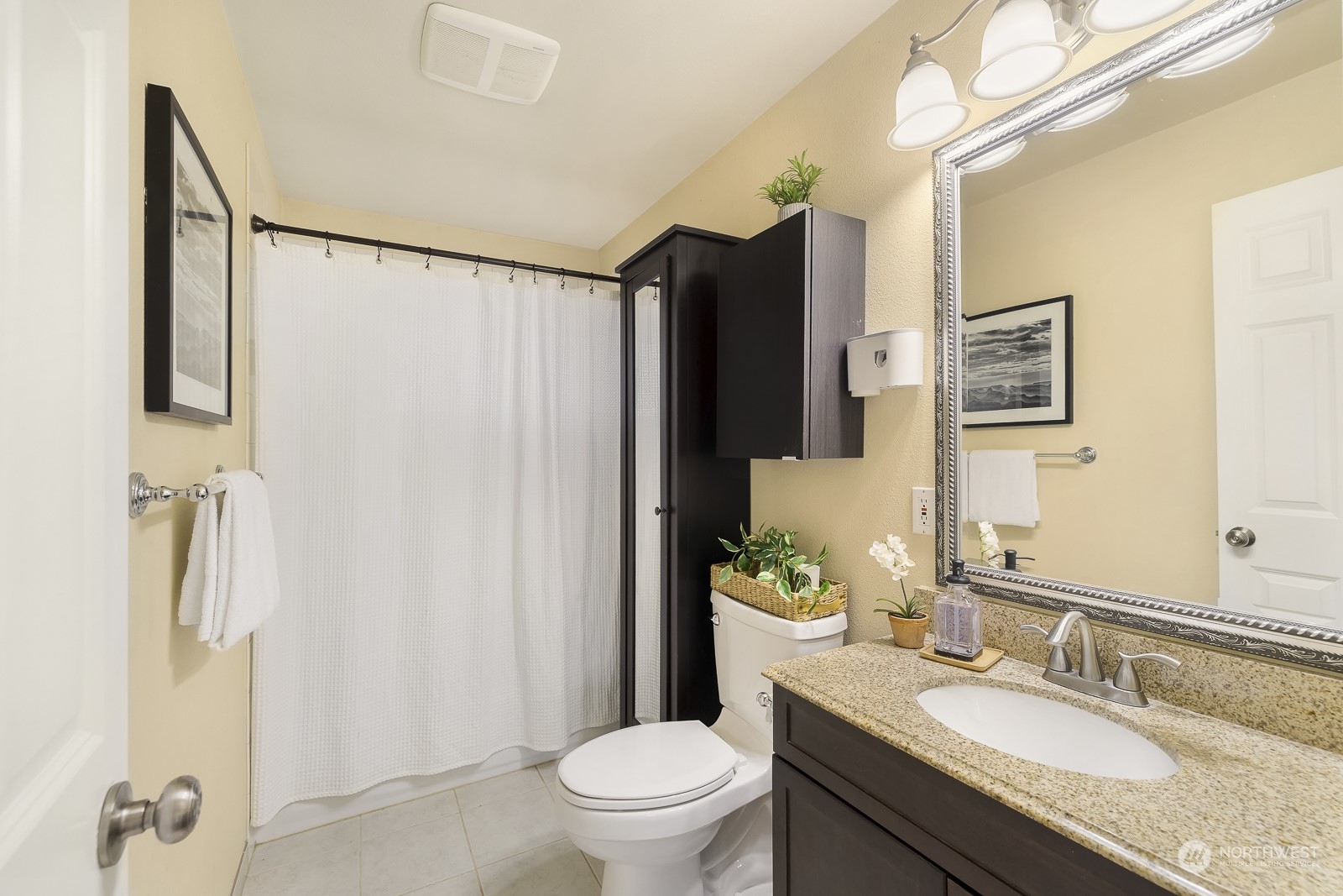 807 Edmonds Avenue Northeast Renton, WA 98056 - Photo 14 of 38 a bathroom with a granite countertop sink toilet and shower