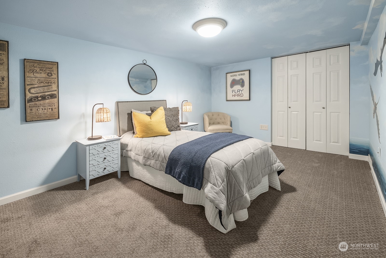 807 Edmonds Avenue Northeast Renton, WA 98056 - Photo 24 of 38 a spacious bedroom with a bed and lamp