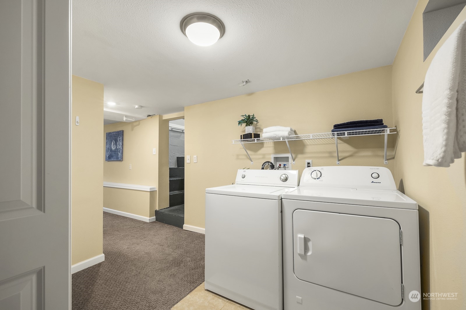 807 Edmonds Avenue Northeast Renton, WA 98056 - Photo 26 of 38 a view of washer and dryer with kitchen in the background