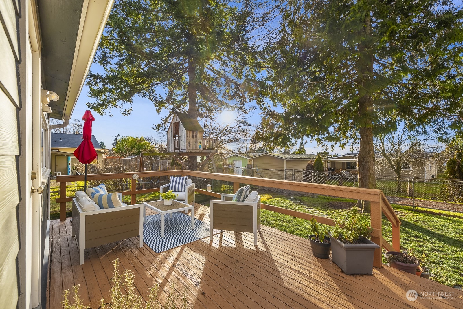 807 Edmonds Avenue Northeast Renton, WA 98056 - Photo 9 of 38 a view of a balcony with wooden floor and outdoor seating