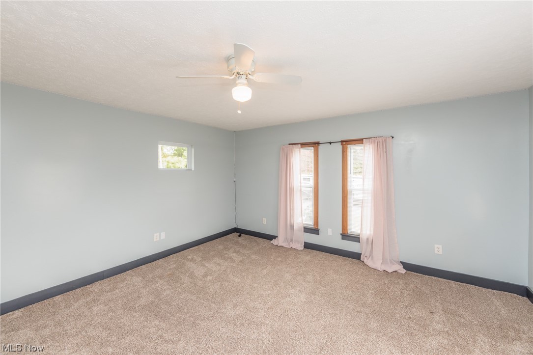2551 Reimer Road Wadsworth, OH 44281 - Photo 28 of 35 Spare room featuring light carpet and ceiling fan