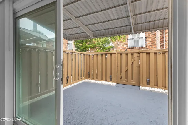 a view of an empty room with a balcony