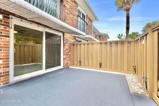a view of a livingroom with a hardwood floor and a ceiling fan