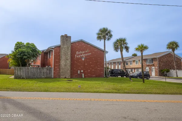 an aerial view of a house with outdoor space