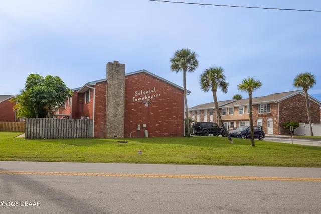 an aerial view of a house with outdoor space