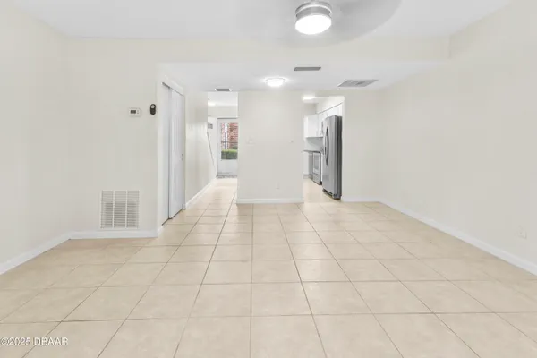 a view of an empty room with a window