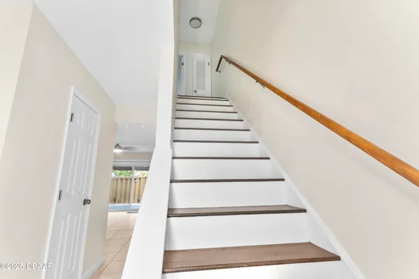 a view of a swimming pool with a garden and plants