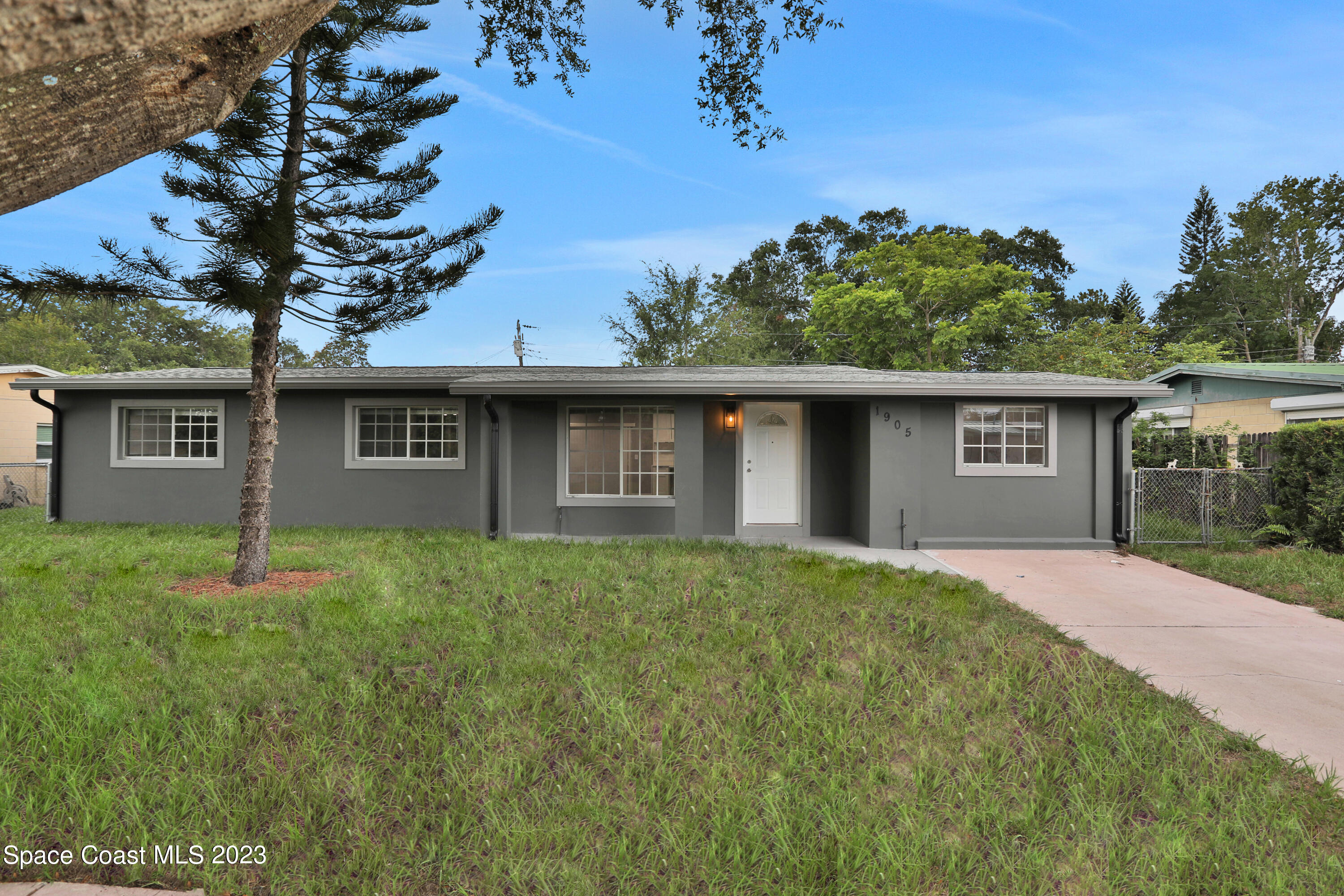 front view of a house with a yard