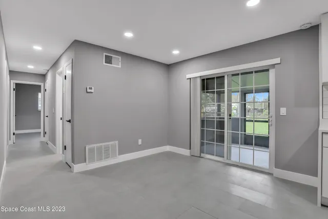 a view of a kitchen with refrigerator and microwave