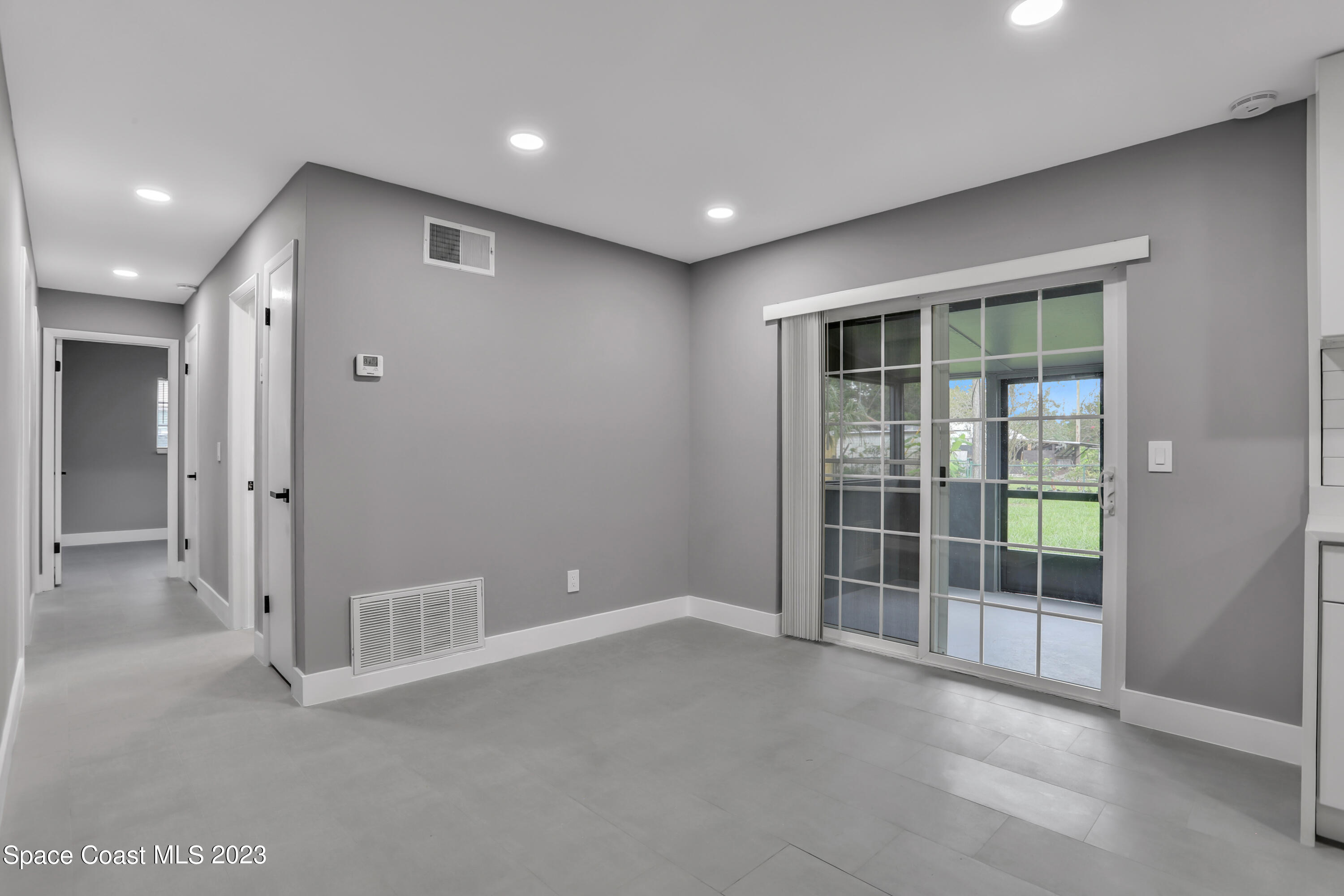 1905 Exeter Drive Cocoa, FL 32922 - Photo 17 of 37 en empty room with windows