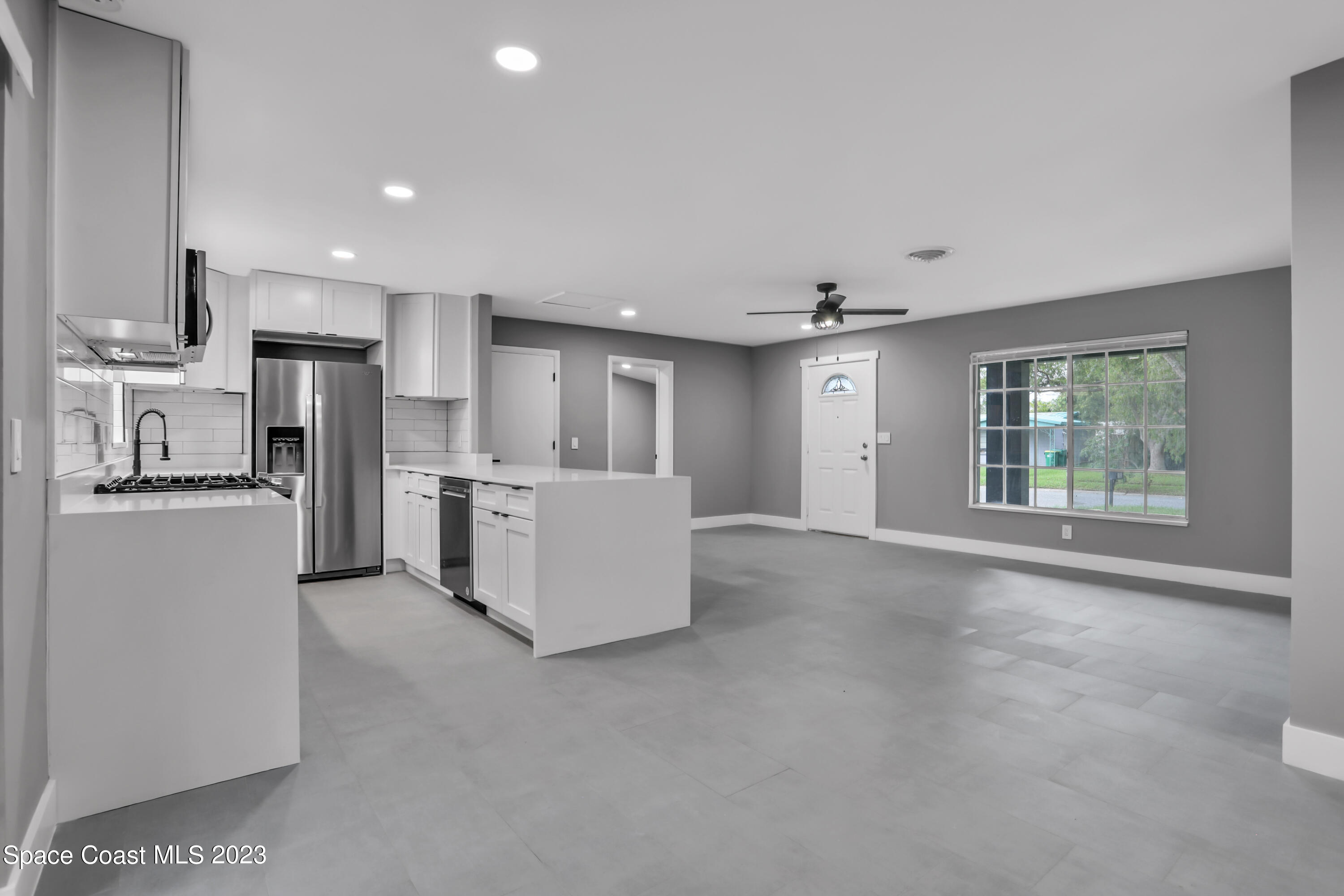 1905 Exeter Drive Cocoa, FL 32922 - Photo 18 of 37 a view of a kitchen with refrigerator and microwave
