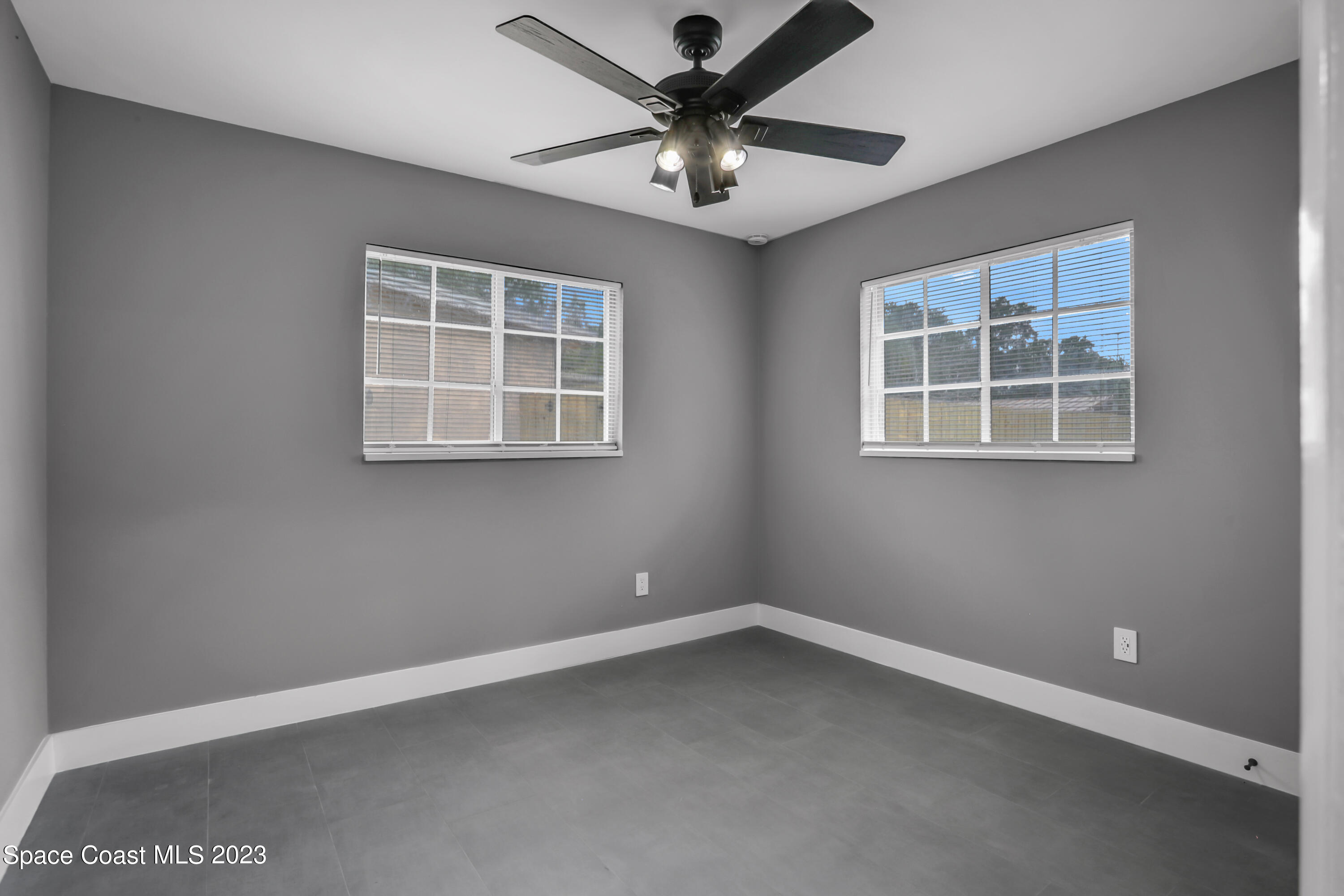 1905 Exeter Drive Cocoa, FL 32922 - Photo 25 of 37 an empty room with a window and a fan