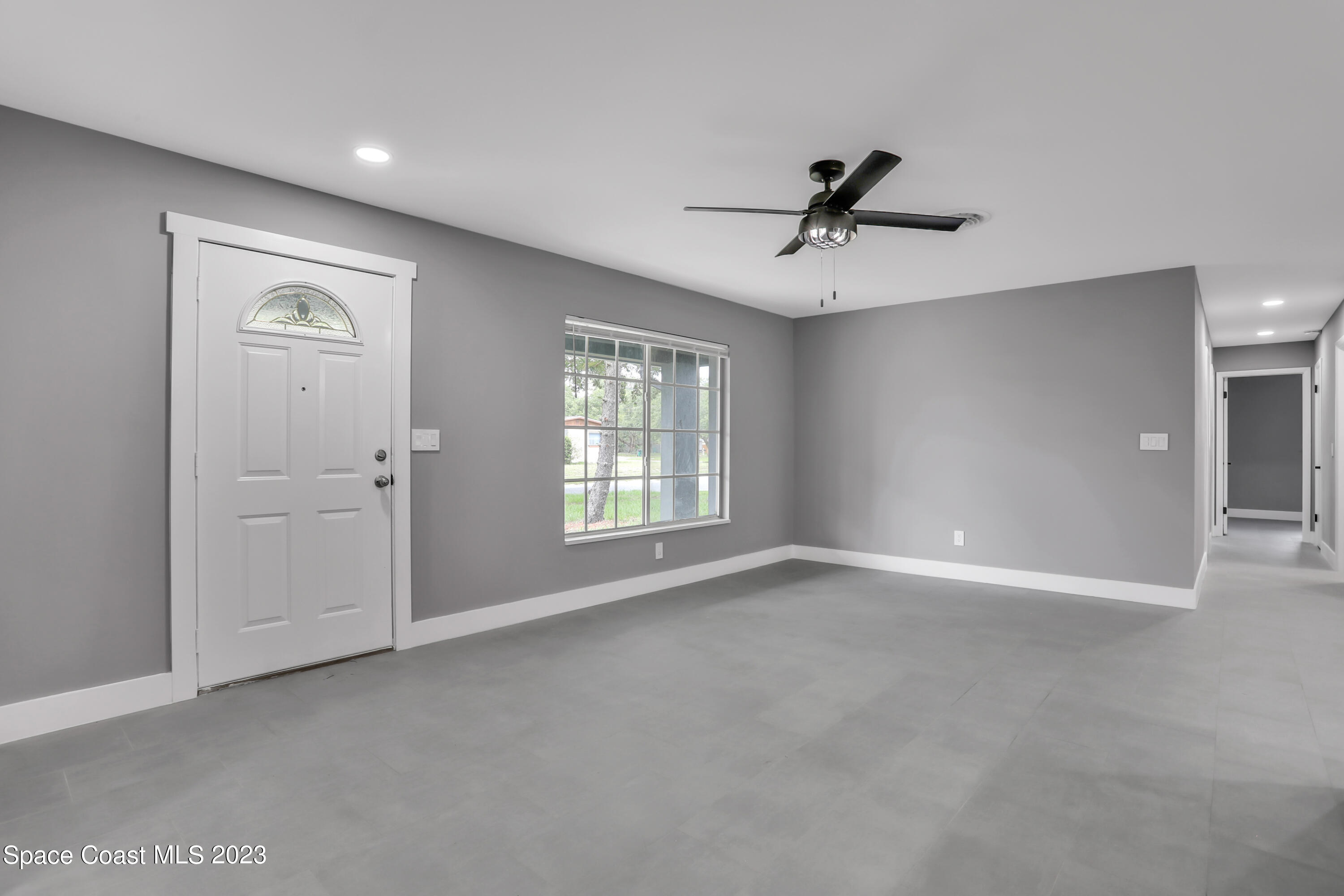 1905 Exeter Drive Cocoa, FL 32922 - Photo 4 of 37 a view of an empty room with a window