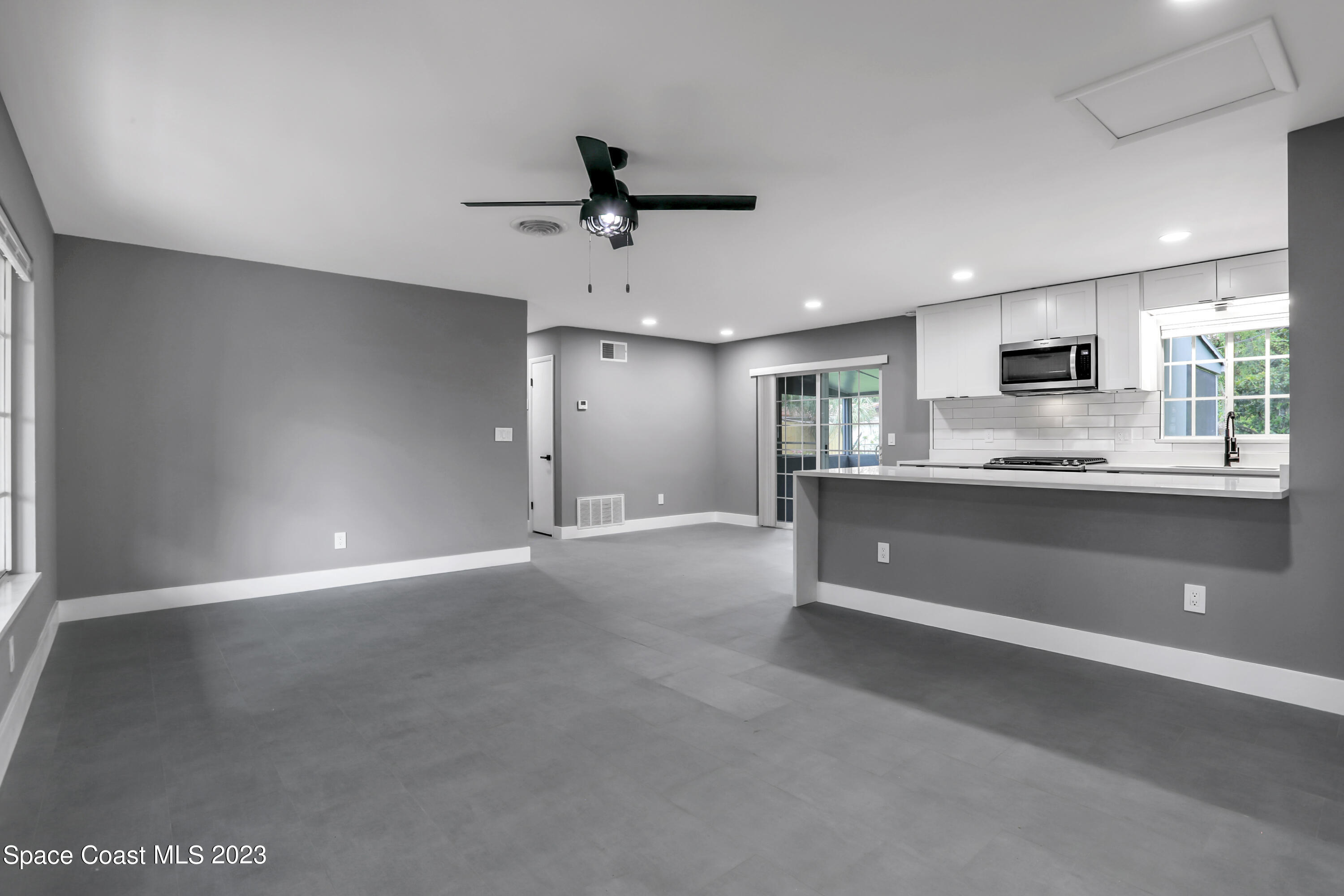 1905 Exeter Drive Cocoa, FL 32922 - Photo 6 of 37 a view of kitchen with refrigerator and window