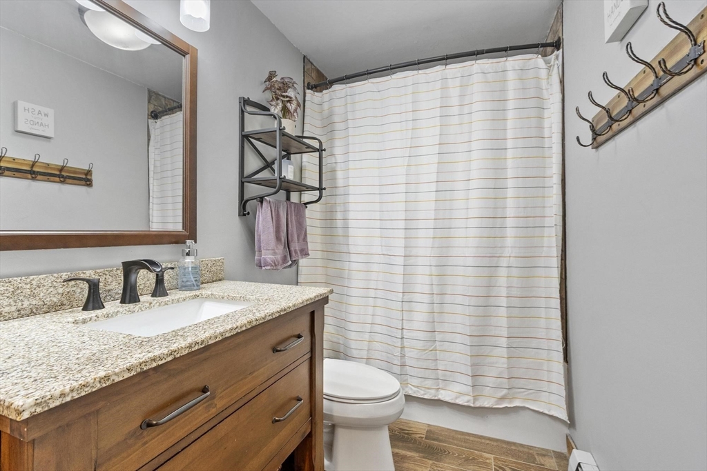 101 Williams Road Ashburnham, MA 01430 - Photo 35 of 42 a bathroom with a granite countertop sink toilet and shower