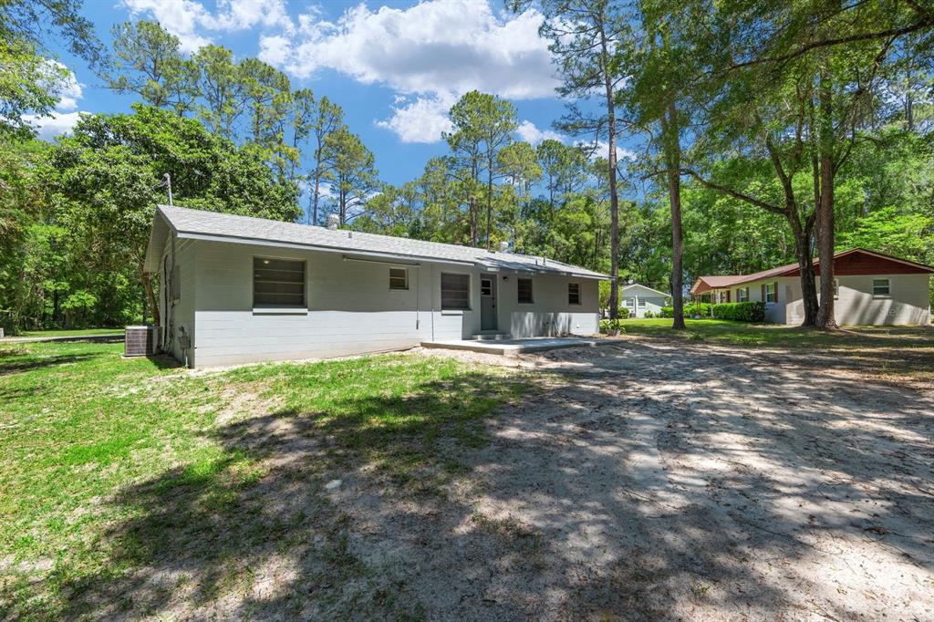 605 Northwest 9th Circle Williston, FL 32696 - Photo 11 of 11 a view of a house with backyard and a tree