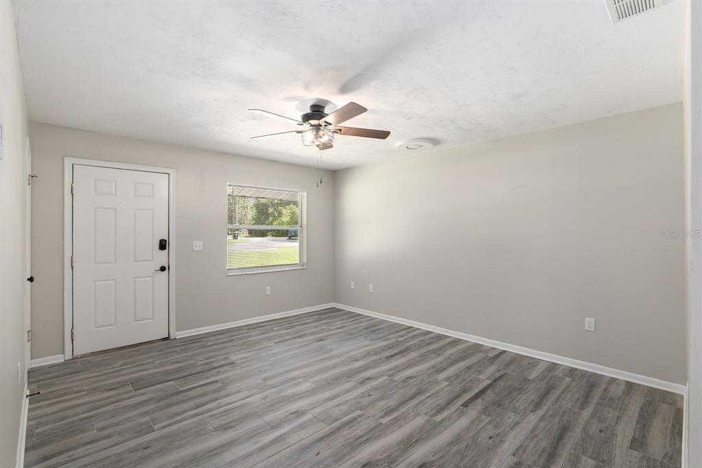 605 Northwest 9th Circle Williston, FL 32696 - Photo 3 of 11 a view of an empty room with a window