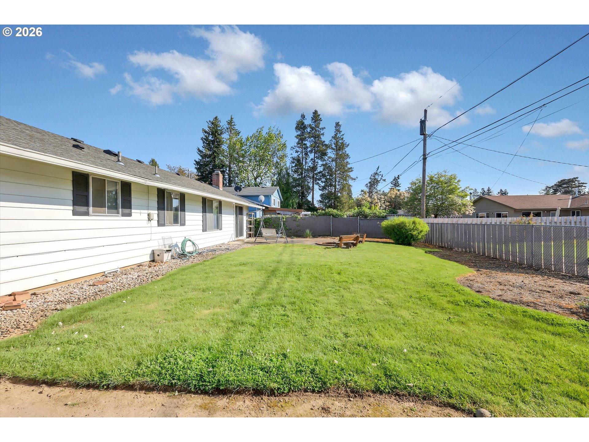 1035 Southeast 225th Avenue Gresham, OR 97030 - Photo 37 of 39 a house view with swimming pool and wooden fence