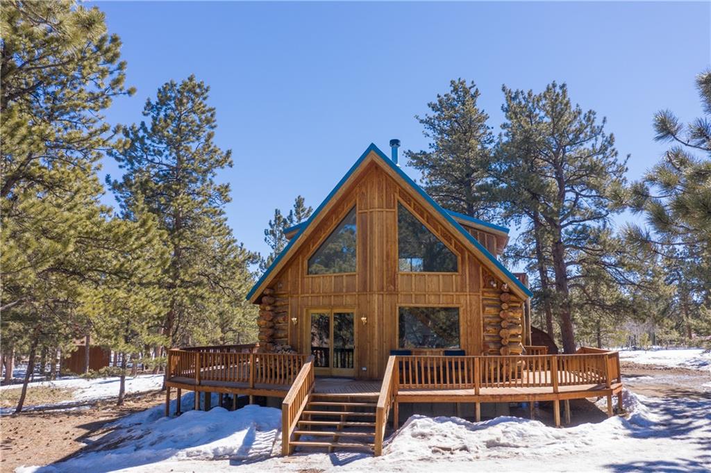 2206 Campfire Road Hartsel, CO 80449 - Photo 2 of 35 a view of a house with a roof deck