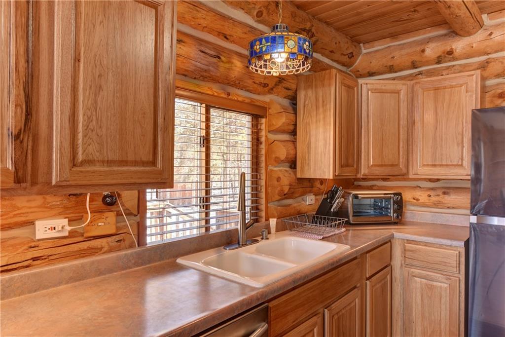 2206 Campfire Road Hartsel, CO 80449 - Photo 12 of 35 a kitchen with a sink and a window