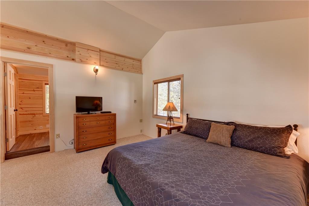 2206 Campfire Road Hartsel, CO 80449 - Photo 18 of 35 a bedroom with a bed and a television